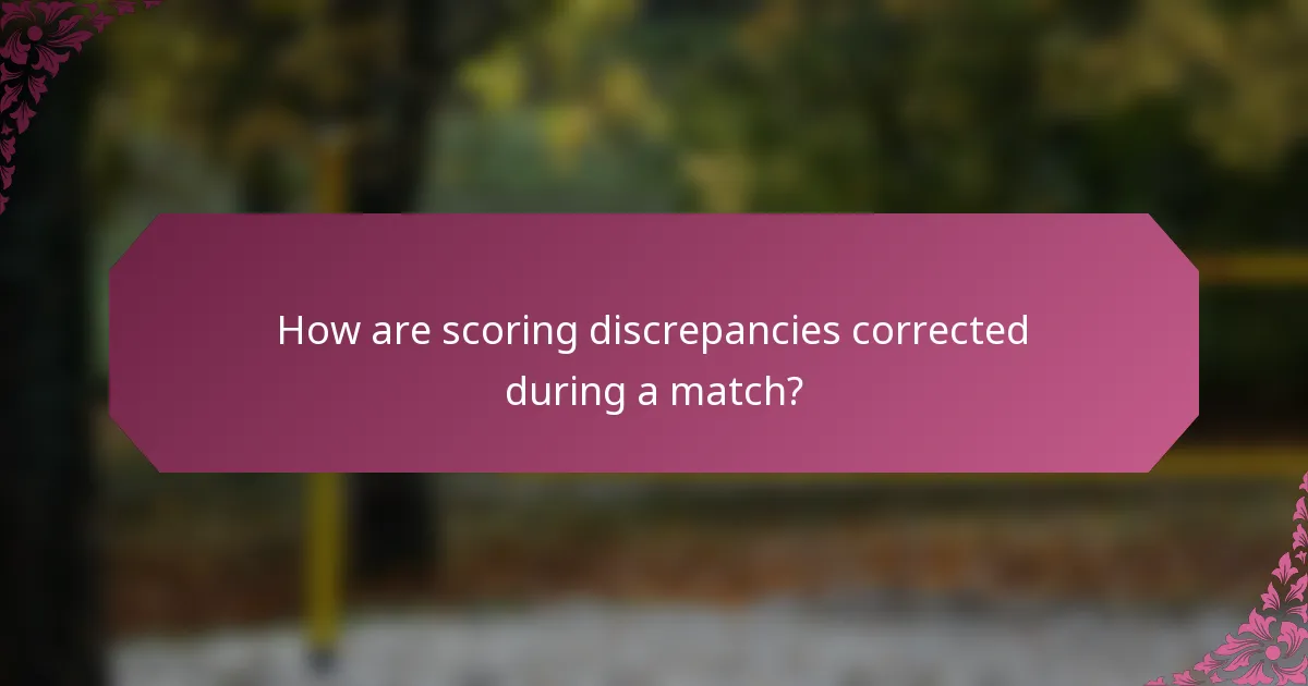 How are scoring discrepancies corrected during a match?
